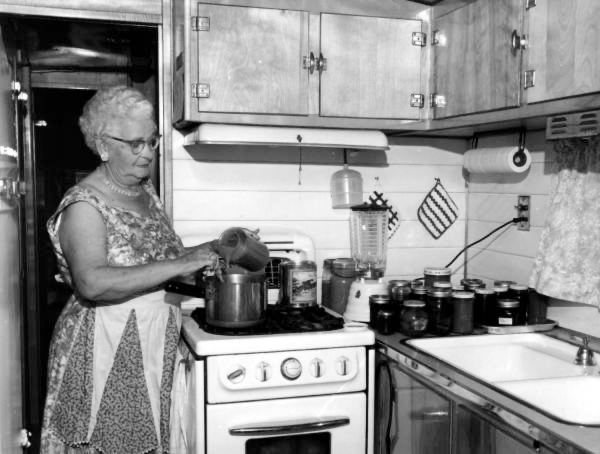 woman cooking in her 1960s kitchen