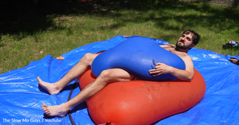 Man Sandwiches Himself Between Two Giant Water Balloons And They Explode In Slow Motion