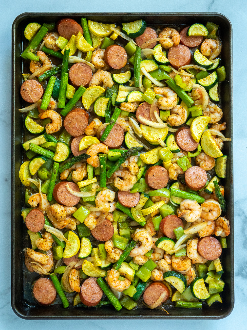 https://cdn.greatlifepublishing.net/wp-content/uploads/sites/2/2022/08/01091926/Cajun-Shrimp-and-Veggie-Sheet-Pan-Dinner-Vertical-4.jpg