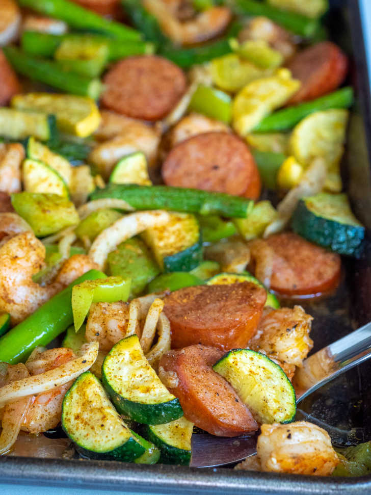 Sheet Pan Sausage & Veggies with Cajun Butter Sauce · Easy Family