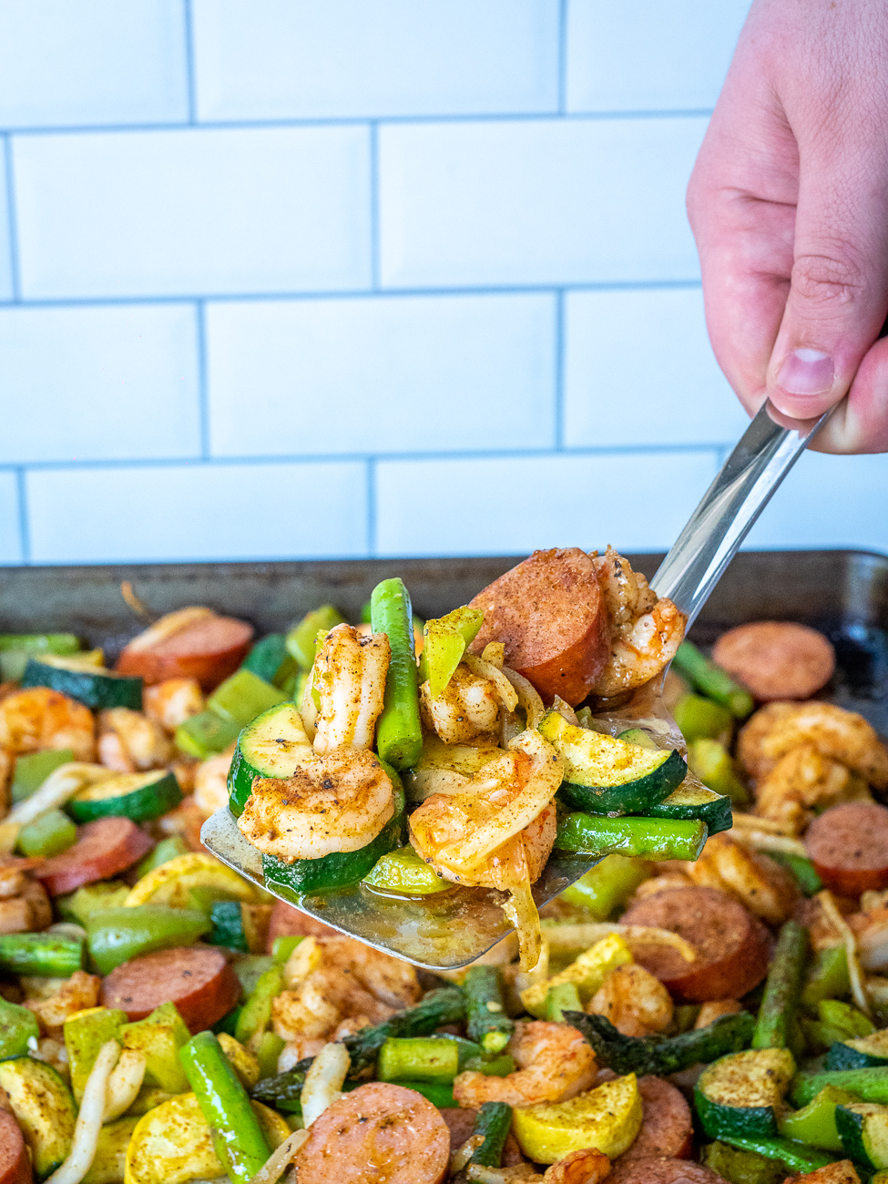 Sheet Pan Sausage & Veggies with Cajun Butter Sauce · Easy Family