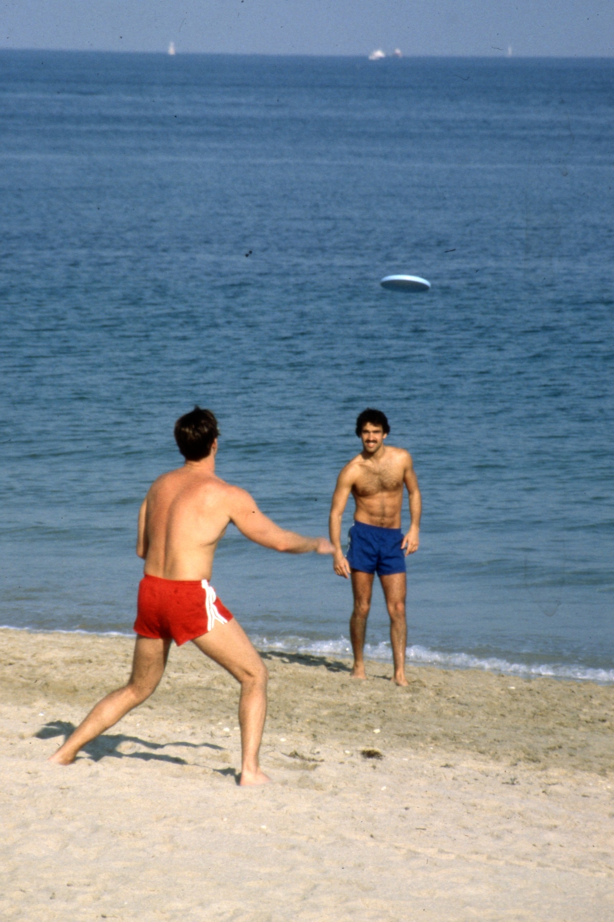 playing Frisbee on Florida beach