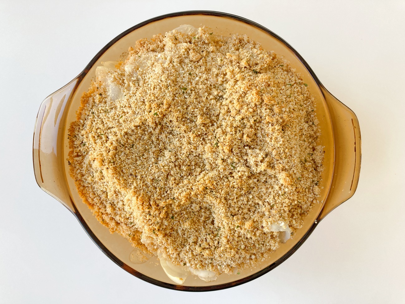 Melt remaining butter and toss with breadcrumbs. Spread this over top of casserole. Bake for 20 minutes or until breadcrumbs are golden brown.