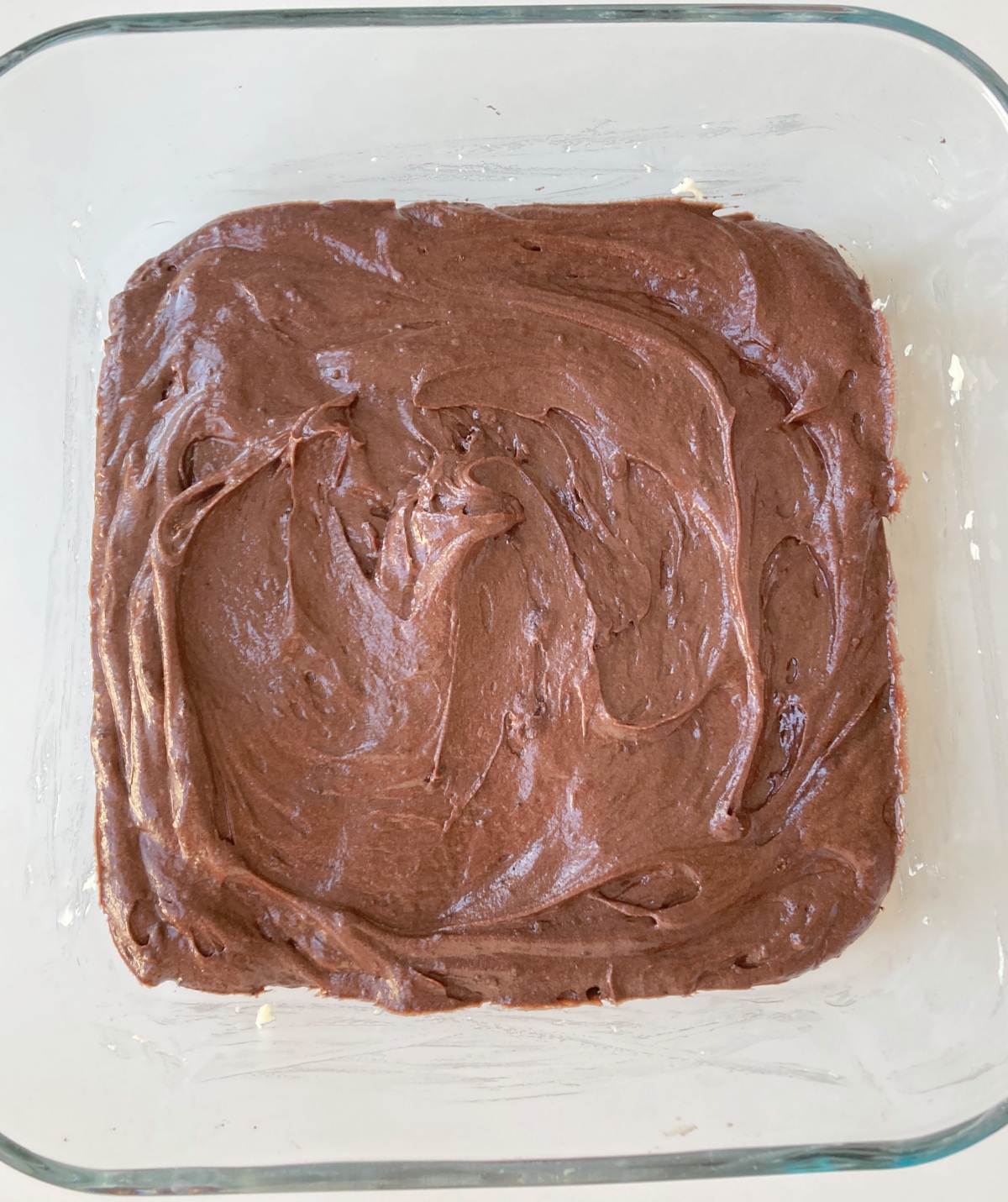 Preheat oven to 350˚F. In a large bowl sift together flour, cocoa powder, baking powder, and 1/4 teaspoon sea salt. In another bowl mix together butter and sugar, then add eggs one at a time. Stir in vanilla, then add dry ingredients to wet. Pour into a greased and lined 8