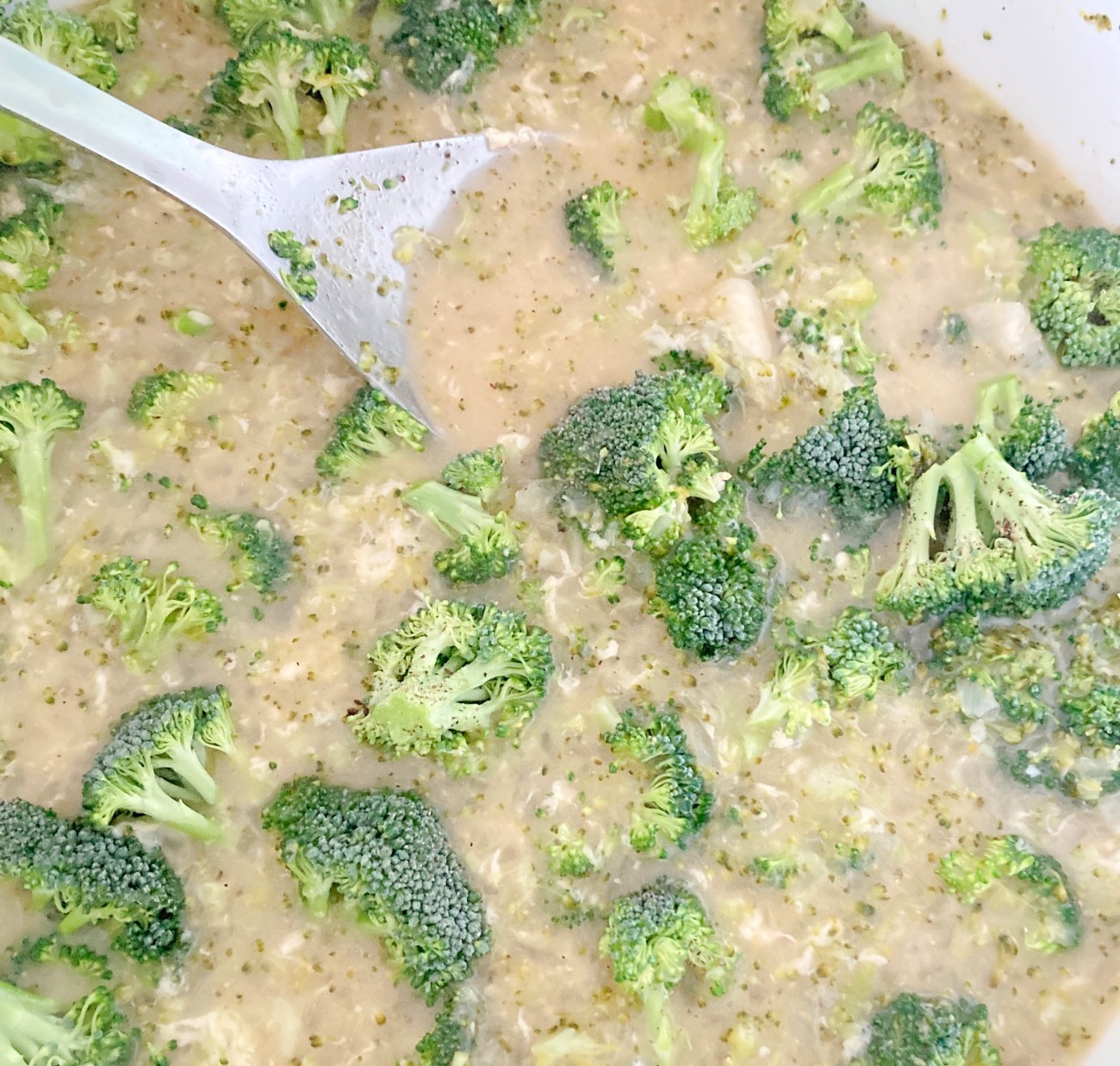 Turn heat to medium-low to simmer. Add 1 1/2 cups gouda in a little at a time, stirring often. Stir in remaining broccoli, vinegar, remaining salt, and white pepper.
