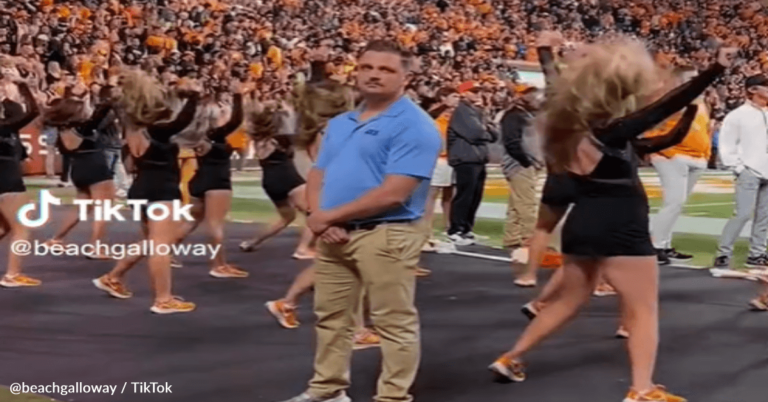 Security Guard Interrupts Cheerleader Routine And Surprises The Crowd