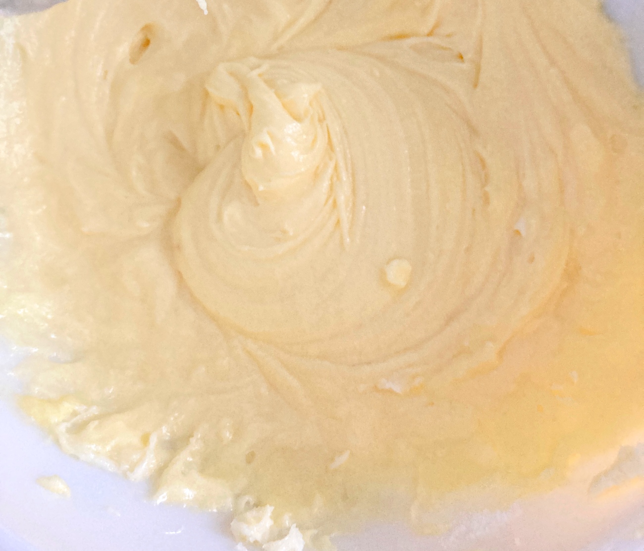 In another bowl cream together butter and sugar. Add eggs one at a time, stirring between each addition. Add milk and vanilla and stir again. Add dry ingredients to wet a little at a time, stirring as you go.