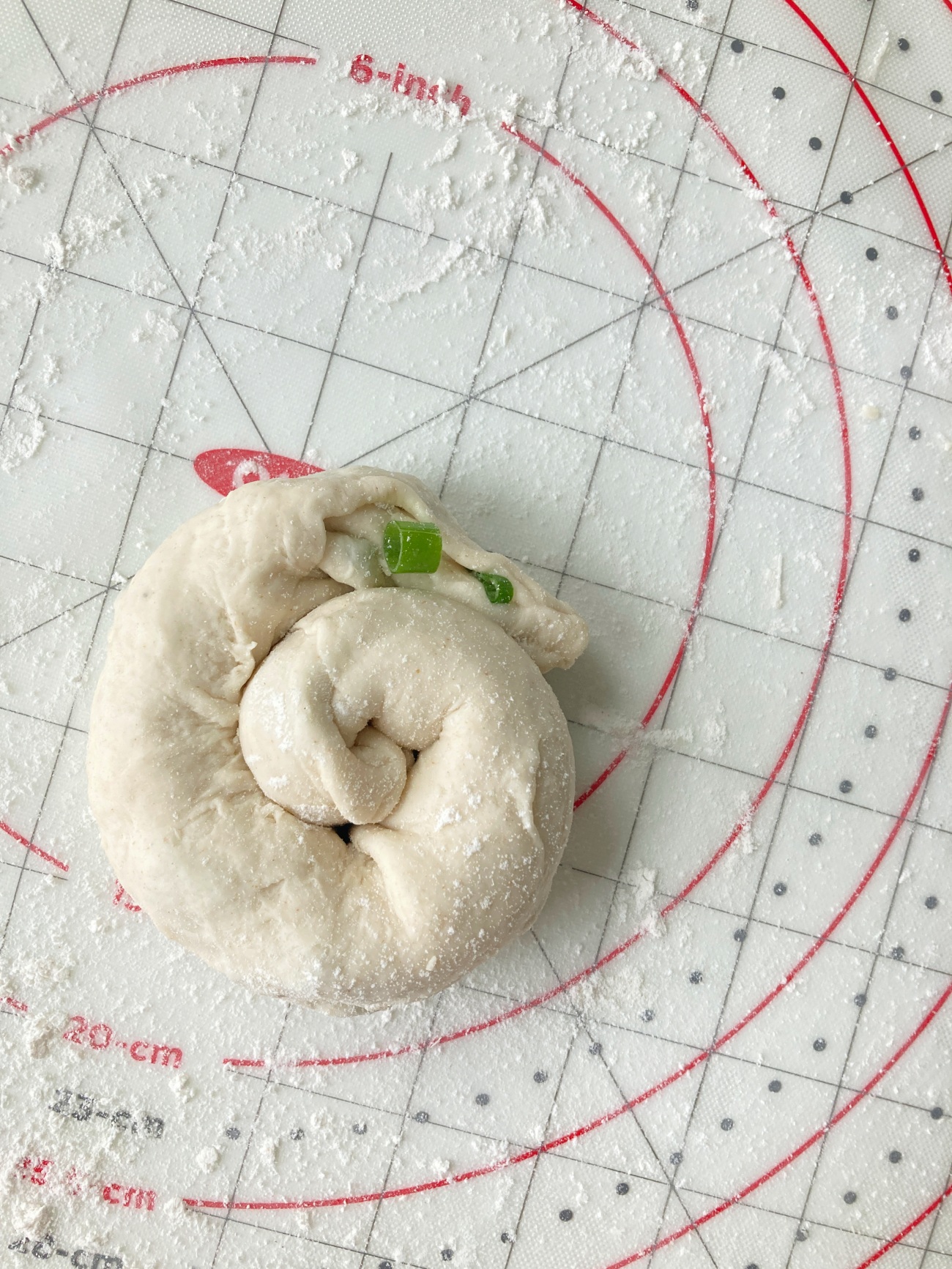 Roll dough into a log starting with the long end. Roll this log into a spiral. Repeat for each pancake.