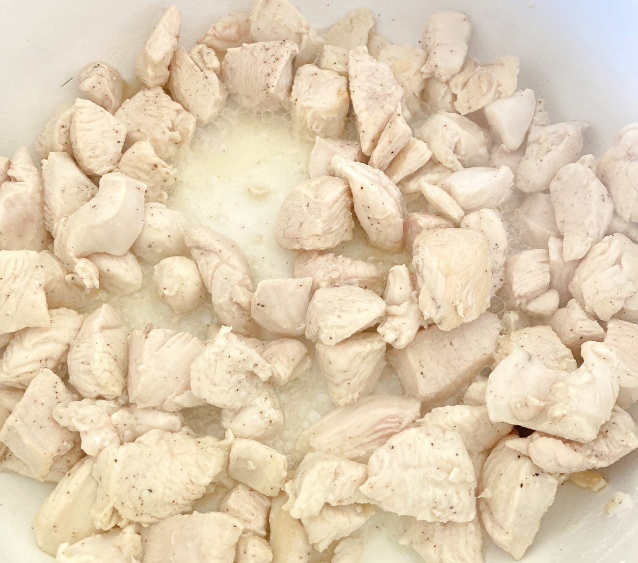 Heat oil in large wok or stockpot to medium. Add chicken and salt and pepper to taste. Cook until no longer pink outside, about 6 minutes. Increase heat to medium-high.