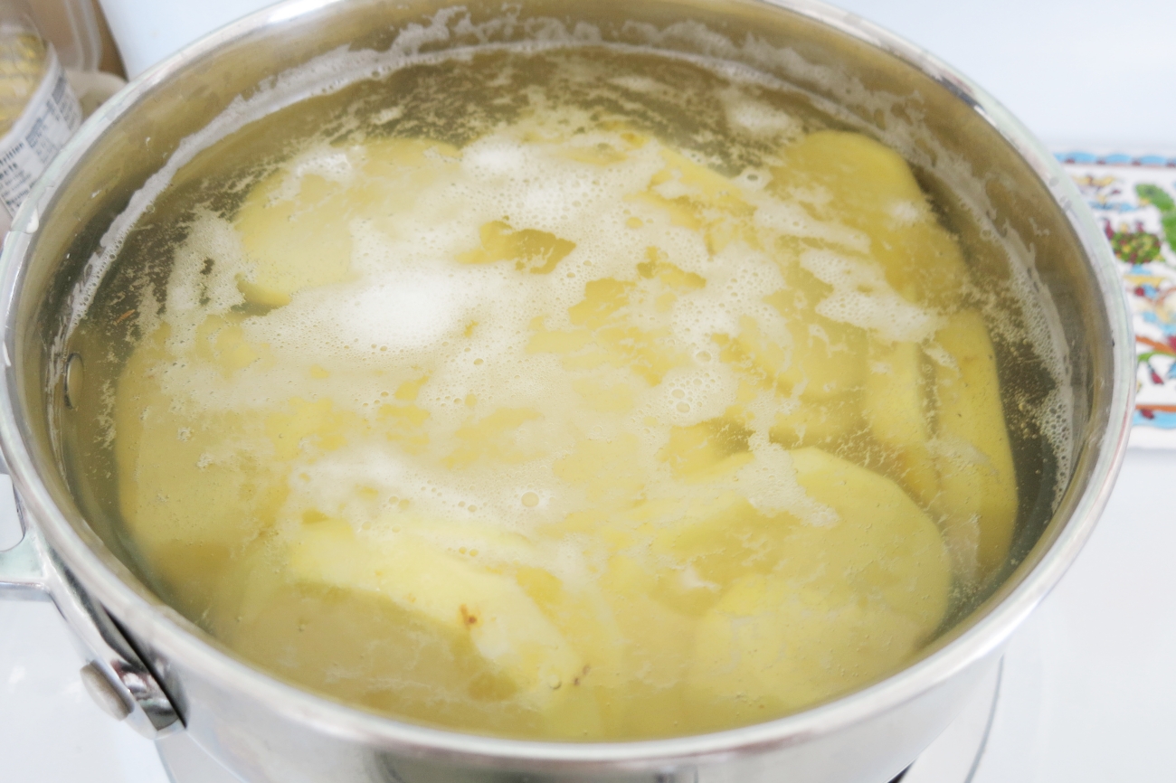 Boil potatoes in heavily salted water for 5 minutes and then drain.