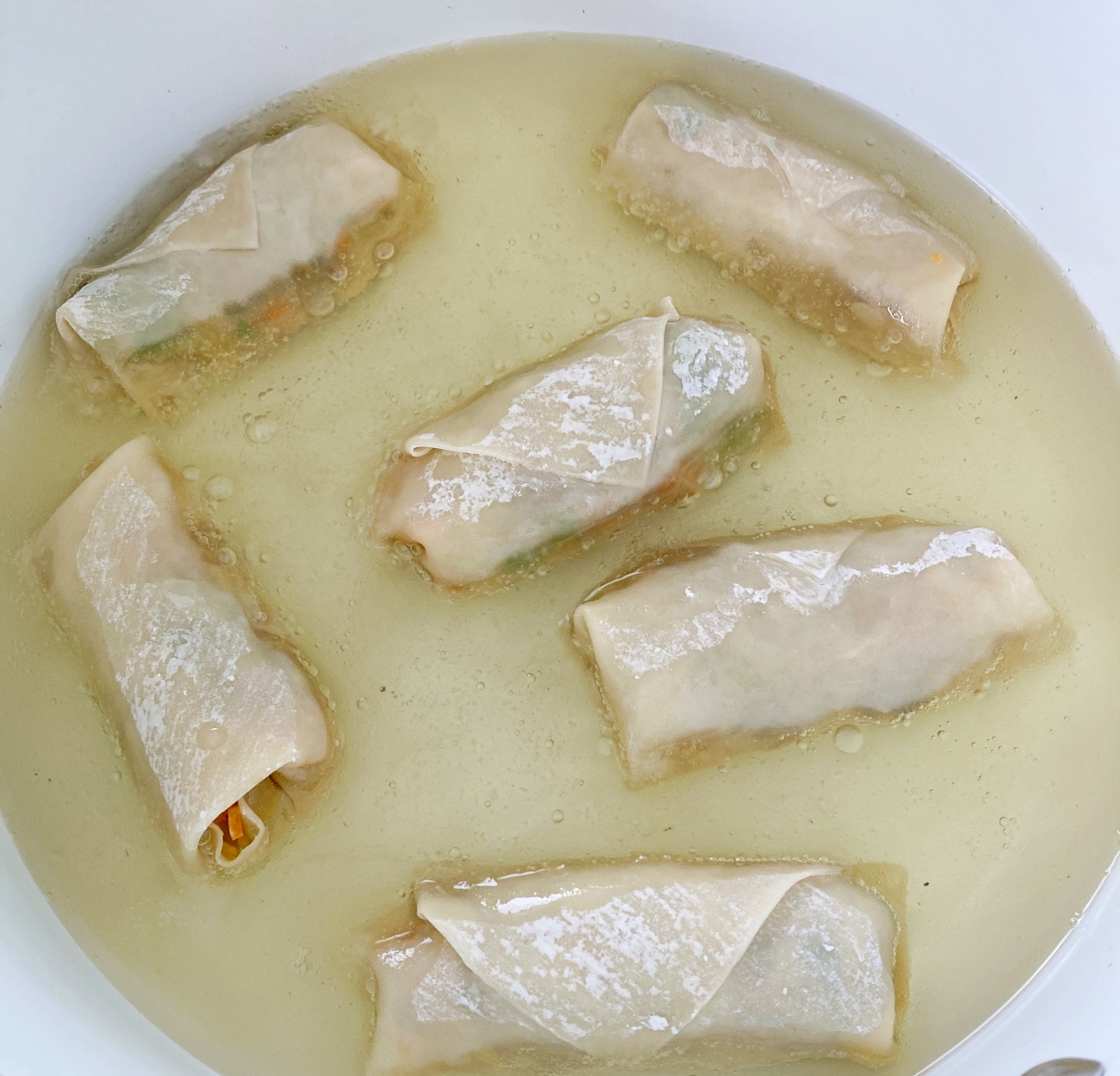 Clean and dry pot and add oil. Heat to medium-high. Add 5 lumpia at a time, frying until golden brown and bubbly on surface, about 5-6 minutes, turning only once if lumpia aren’t fully submerged in oil.