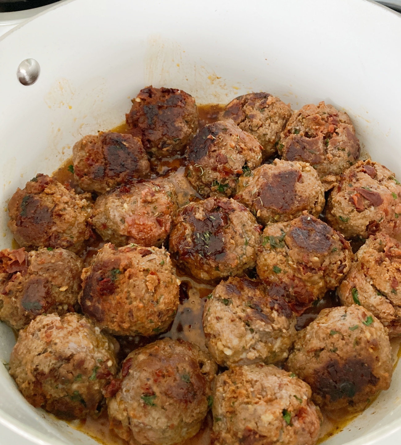 Heat olive oil in large skillet on medium. Add meatballs and cook 4-5 minutes each side.