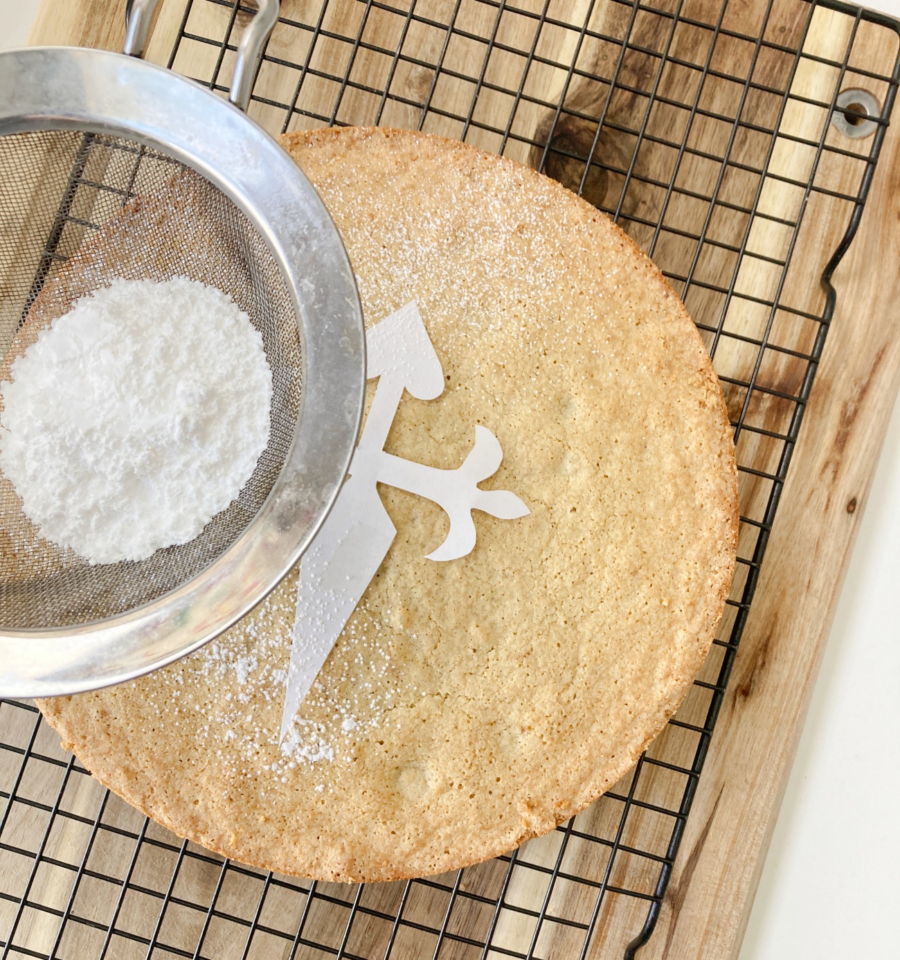 Allow to cool for 15 minutes before releasing from pan. Place on wire cooling rack and allow to cool completely before dusting with powdered sugar, preferably using a cross of St. James stencil.