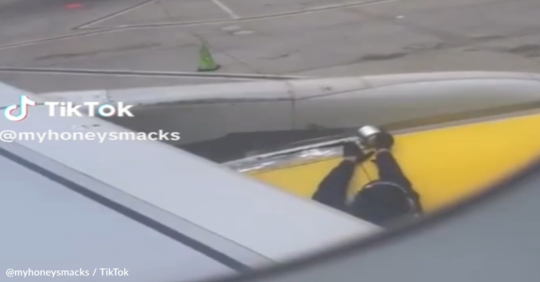 Woman Films Spirit Airlines Employee Taping The Airplane Before Takeoff
