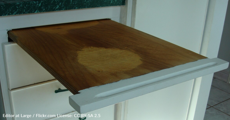 The Real Purpose Of Pull-Out Cutting Boards In Kitchens