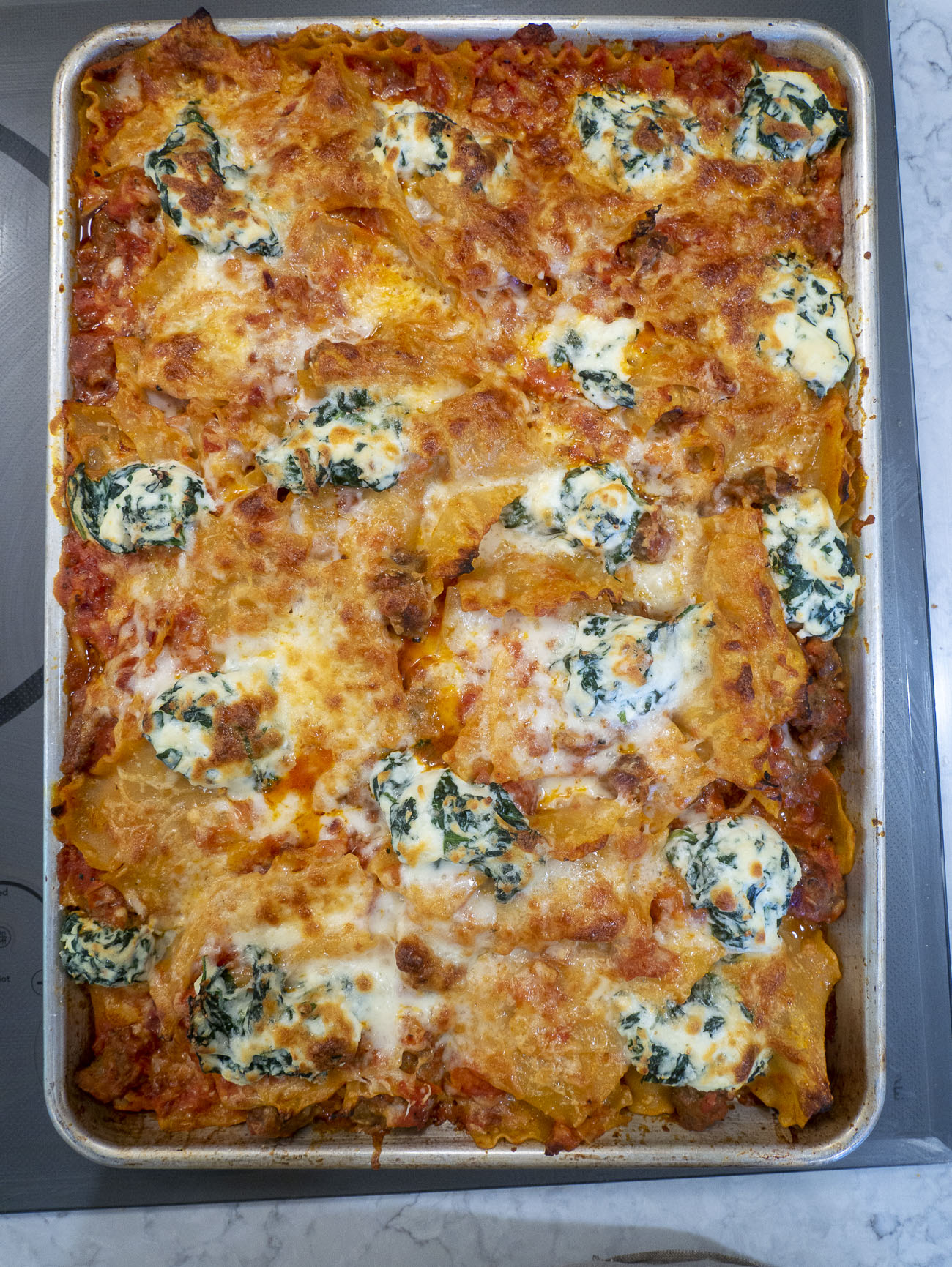 https://cdn.greatlifepublishing.net/wp-content/uploads/sites/2/2023/05/10123628/Giadas-Crispy-Sheet-Pan-Lasagna-Vertical_08.jpg