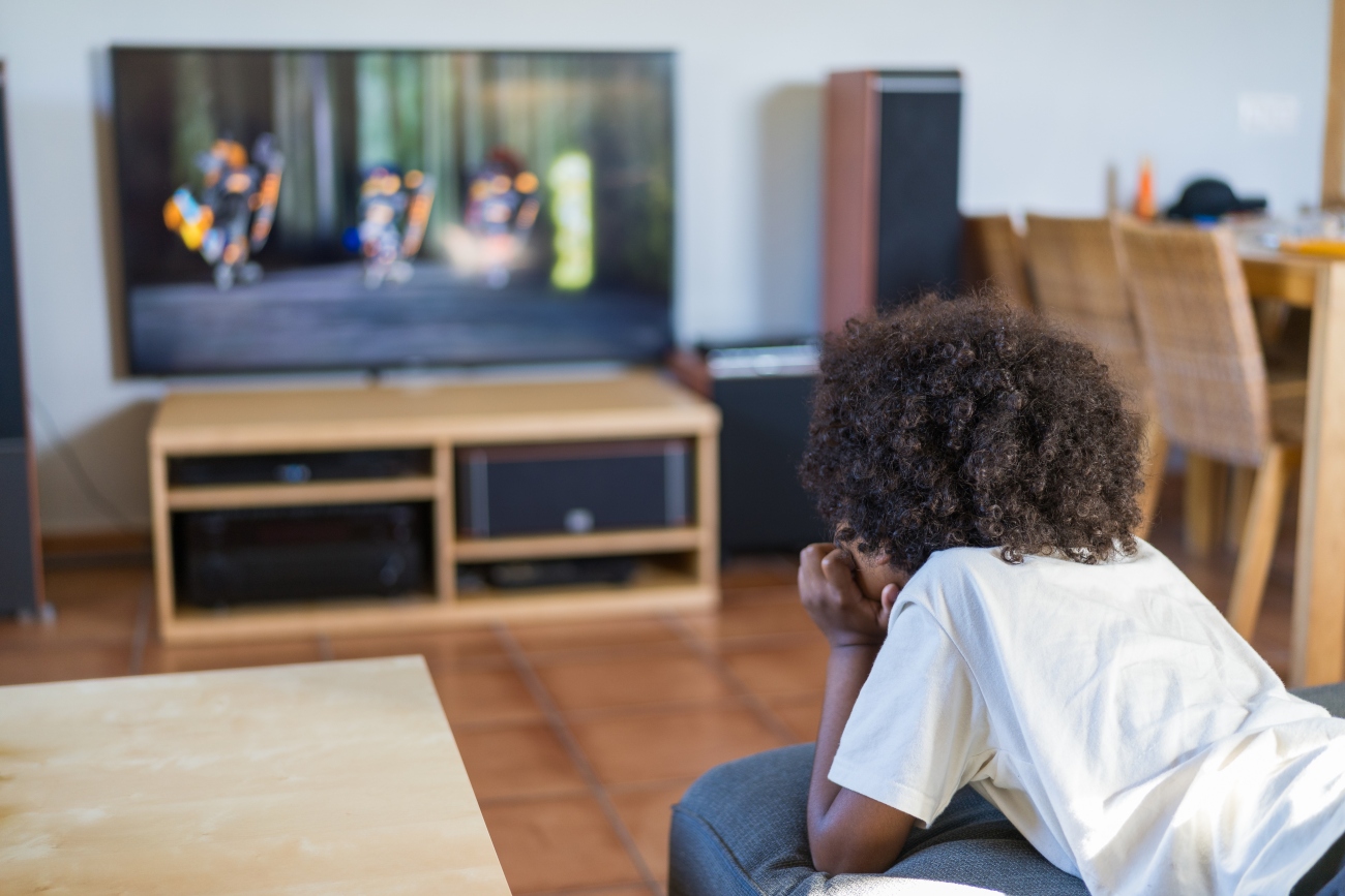 Kid Watching TV on Their Stomach