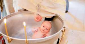 baby being baptized in Orthodox church