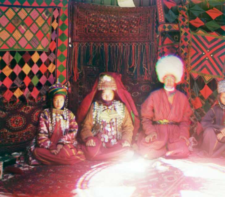 traditional clothing seen on Eurasian people inside a yurt, early 1900s