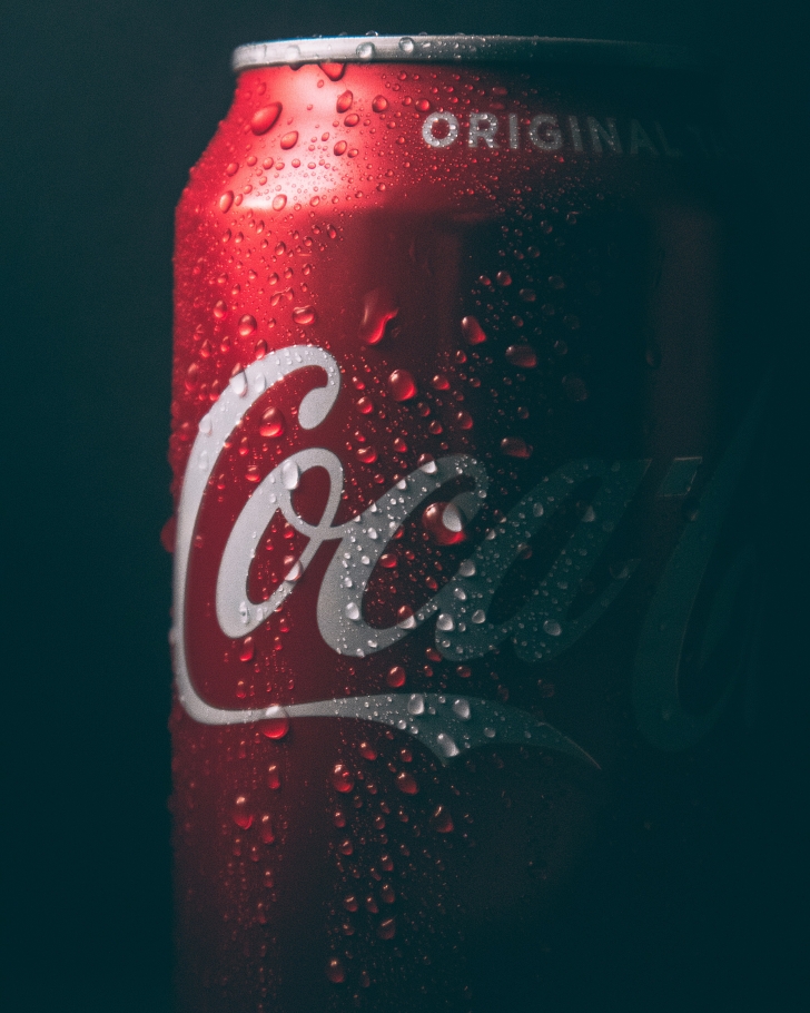 can of coca cola on dark background