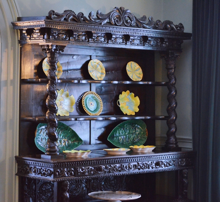 china hutch with decorative serving pieces on top