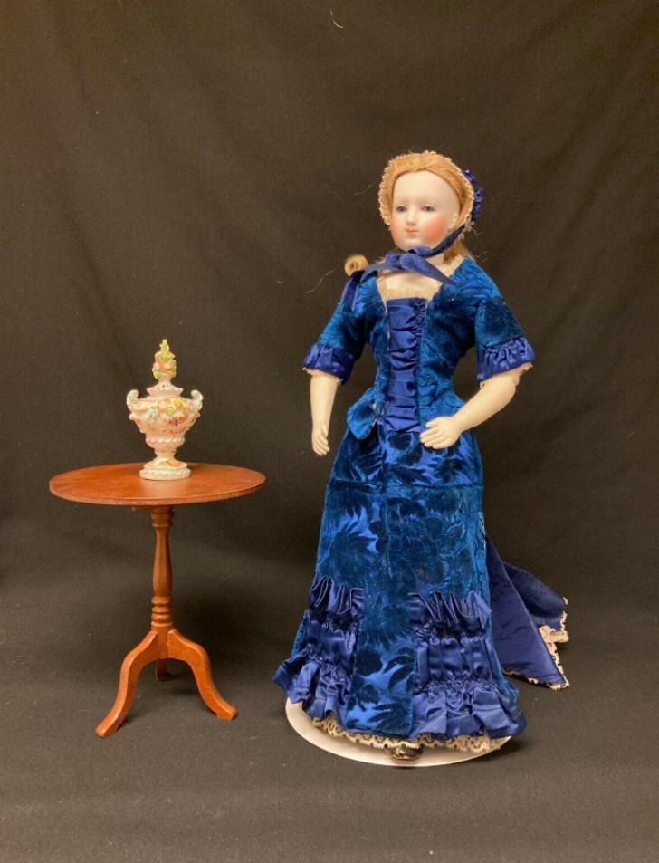 1870s fashion doll in blue velvet dress