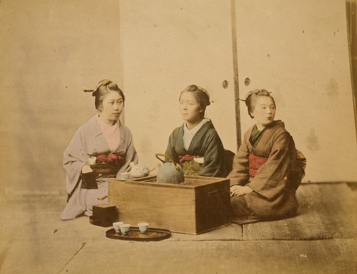 colorized photo of 3 Japanese women having tea from 1877