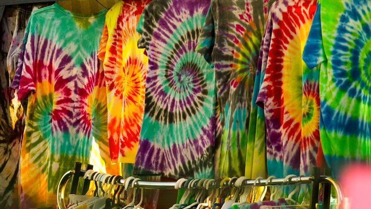 tie dye t shirts on a rack