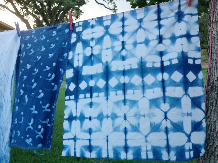 shibori cloth drying on a line outside