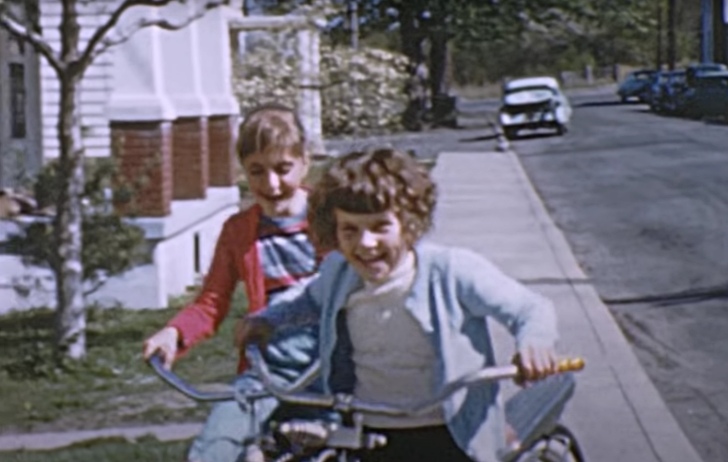 children riding their bikes in the 1950s