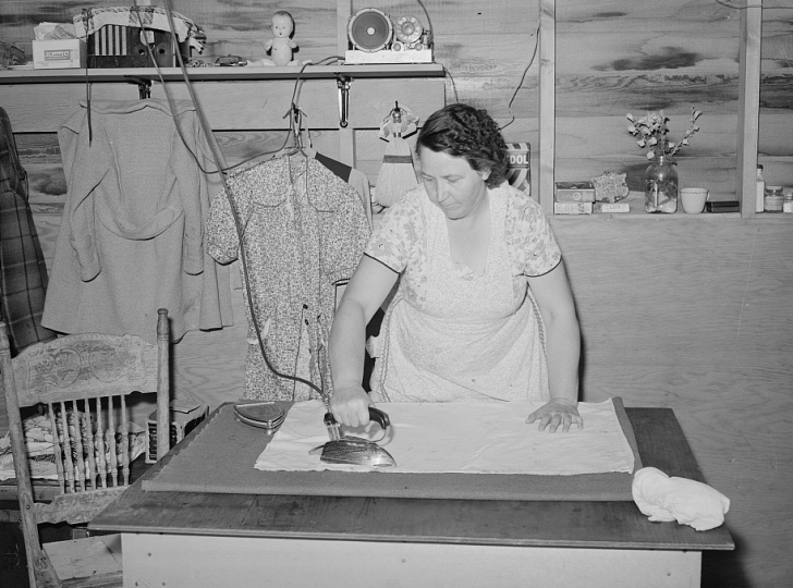 woman ironing clothes, 1941