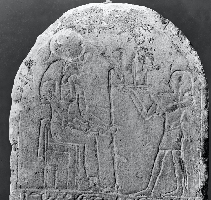 stela depicting Apries offering land