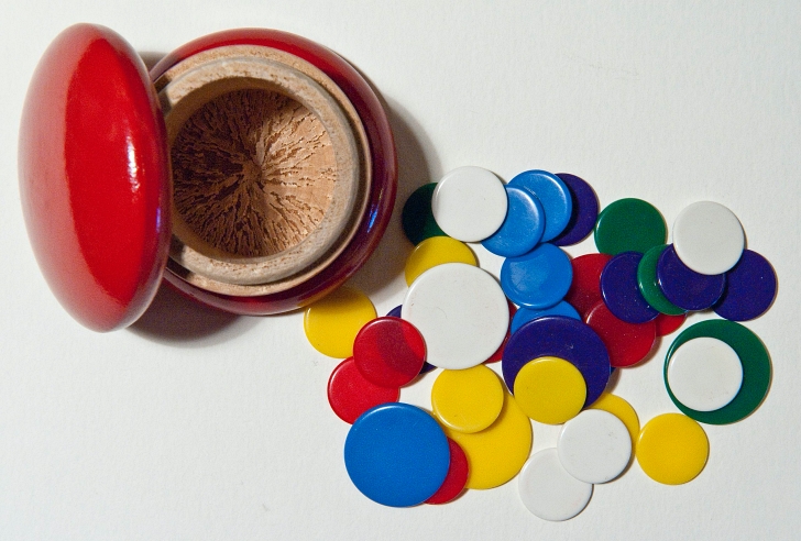 tiddlywinks game pieces and pot
