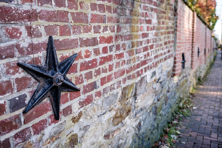 6 point star on historic brick building