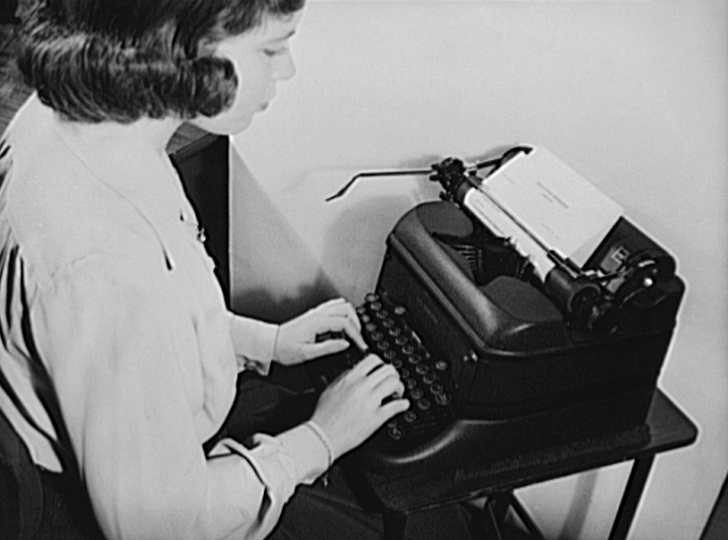 female secretary at typewriter