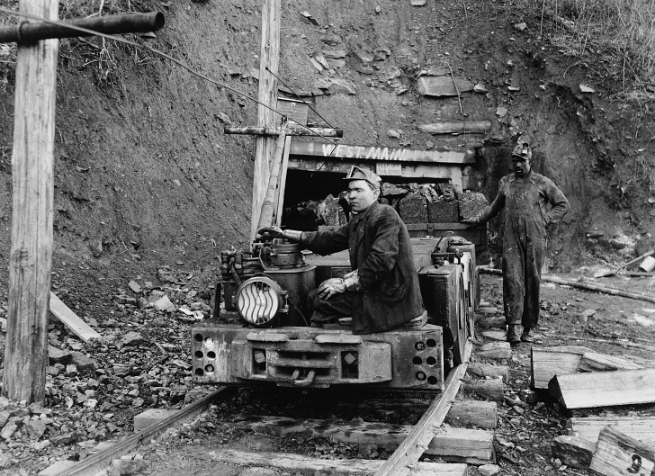 early 20th century coal miners removing coal from shaft