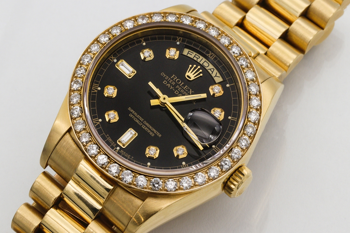 18K gold Rolex with both day and date dials