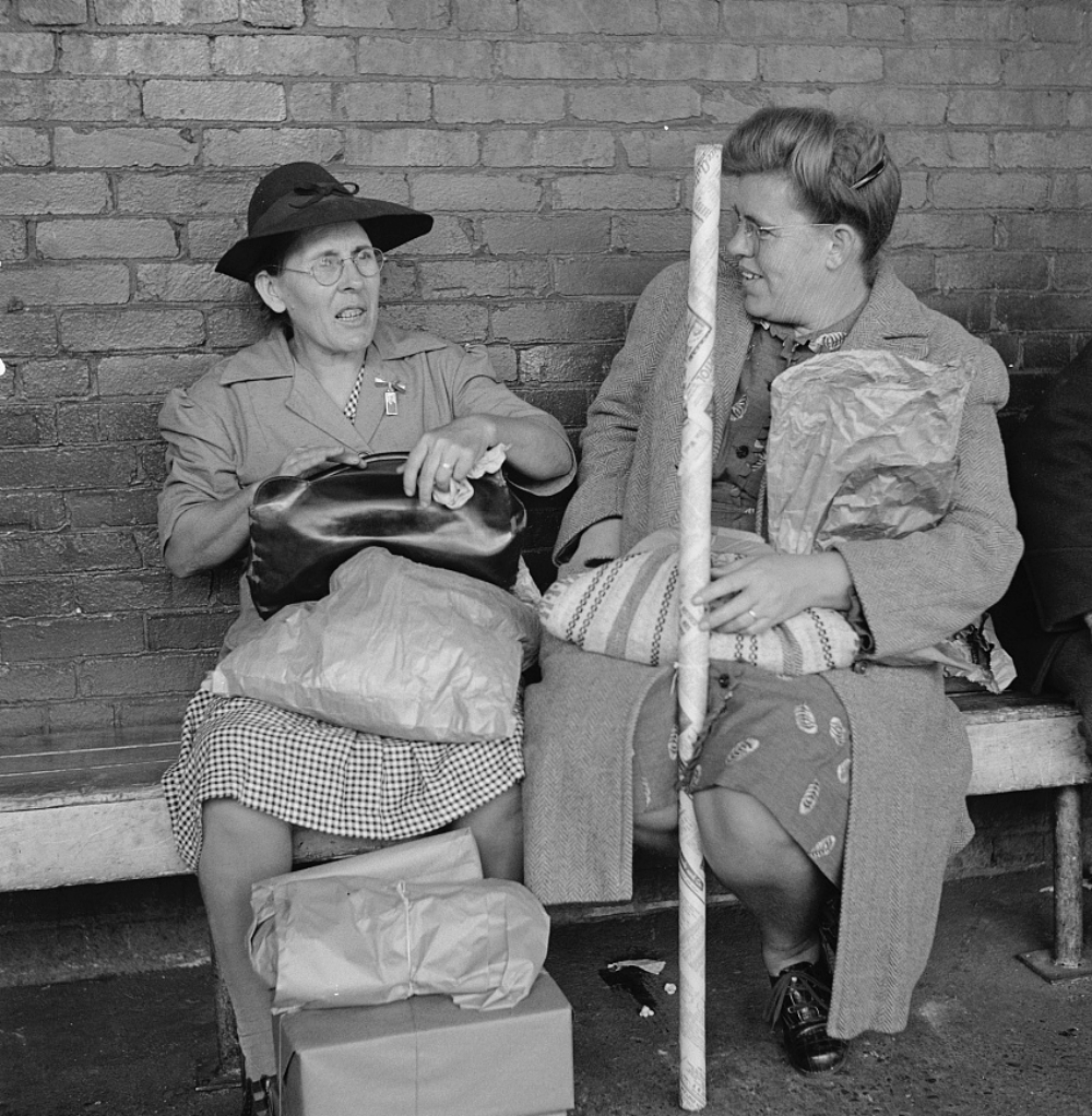 two women returning home by Greyhound bus after Christmas shopping 1943