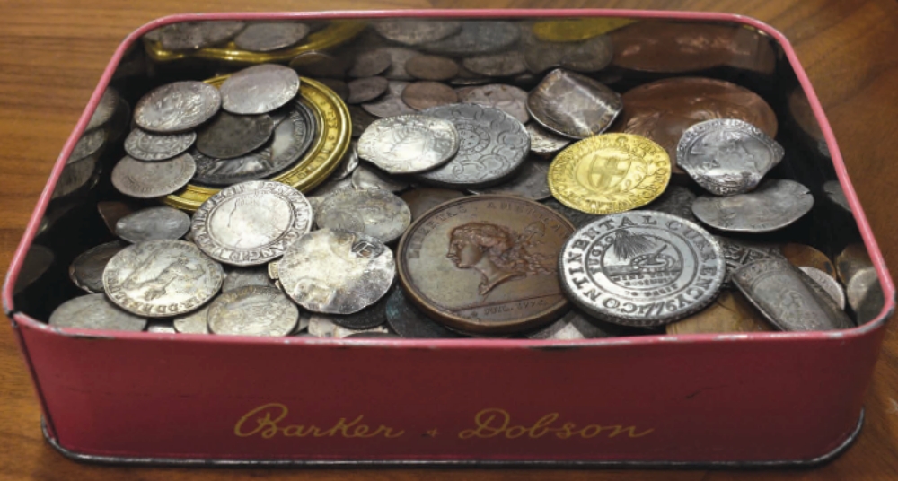 candy tin full of coins