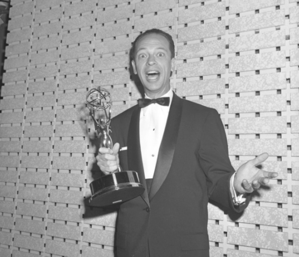 Don Knotts holding an Emmy he just won 1961