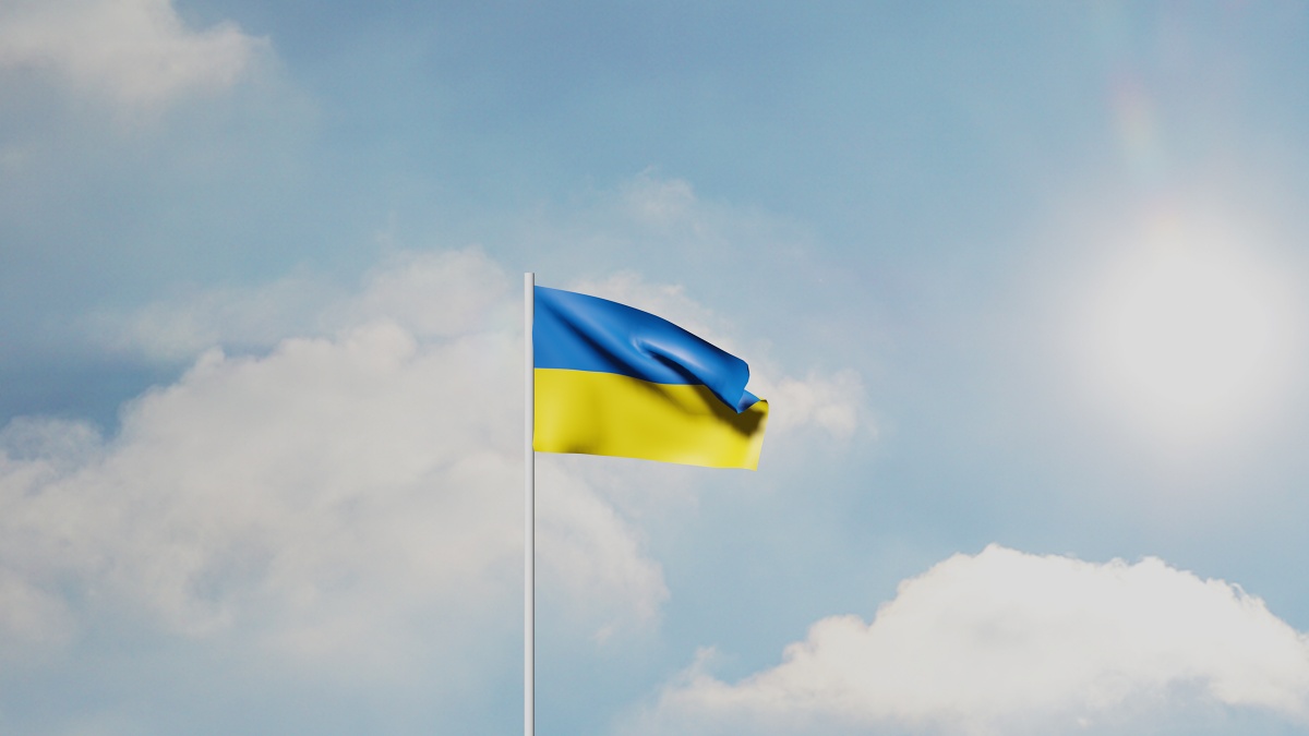 rendering of Ukrainian flag against blue sky and clouds