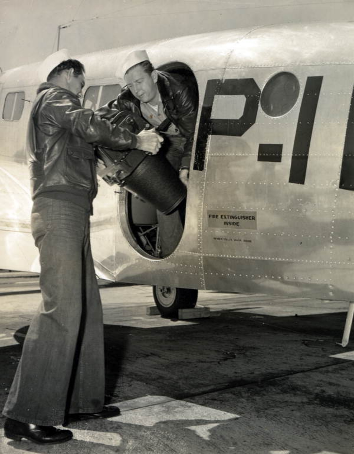 sailors preparing aerial photography equipment during WWII