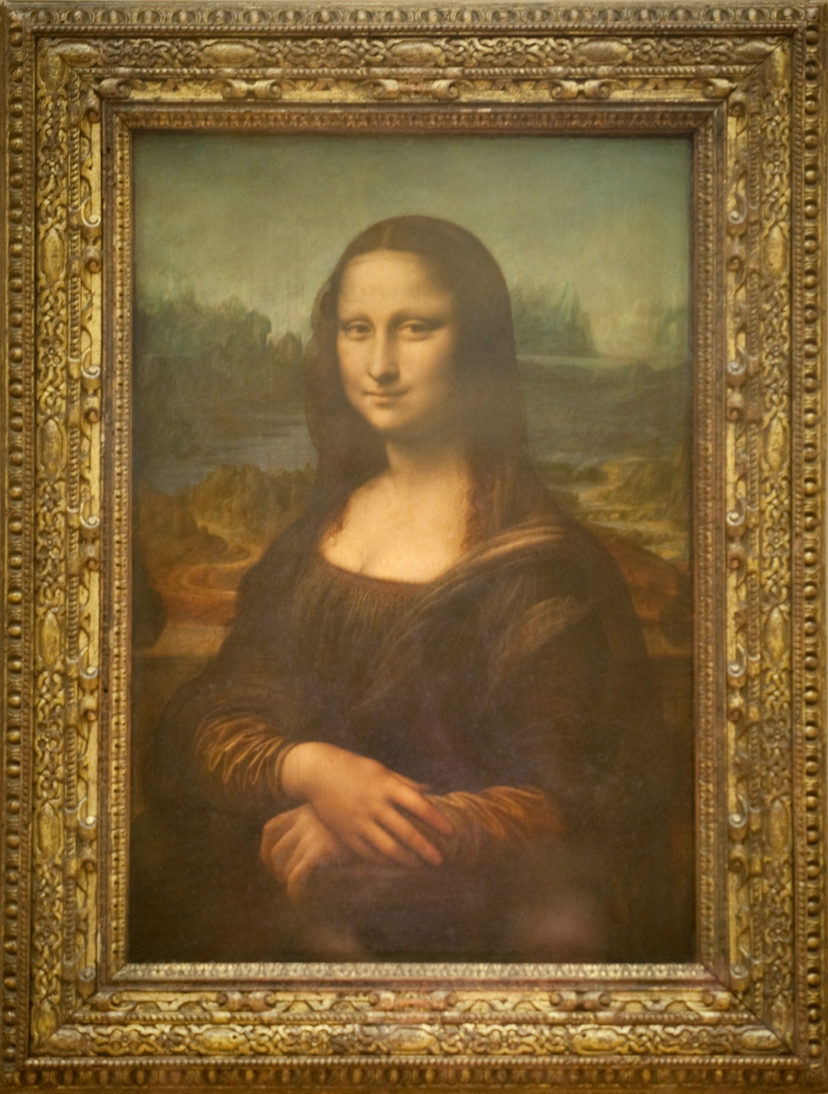 Mona Lisa in gold frame at the Louvre