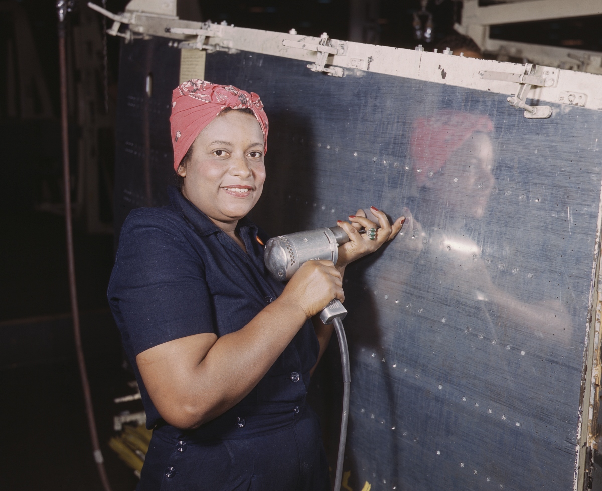 woman making rivets during WWII
