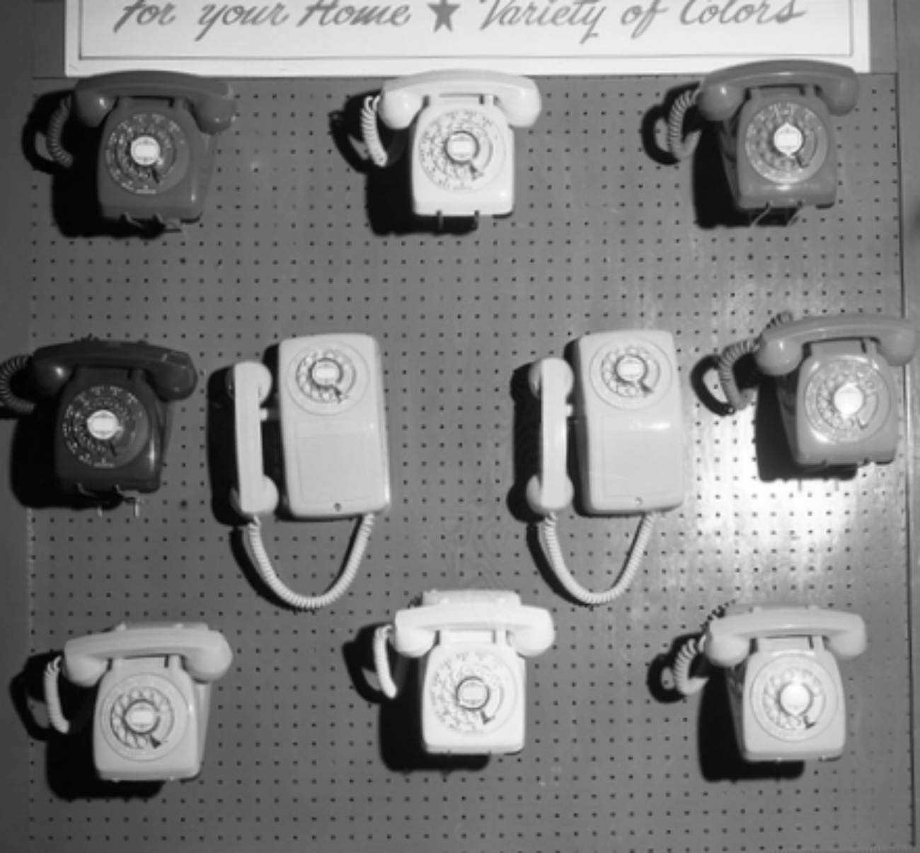 phones on pegboard display 1950s