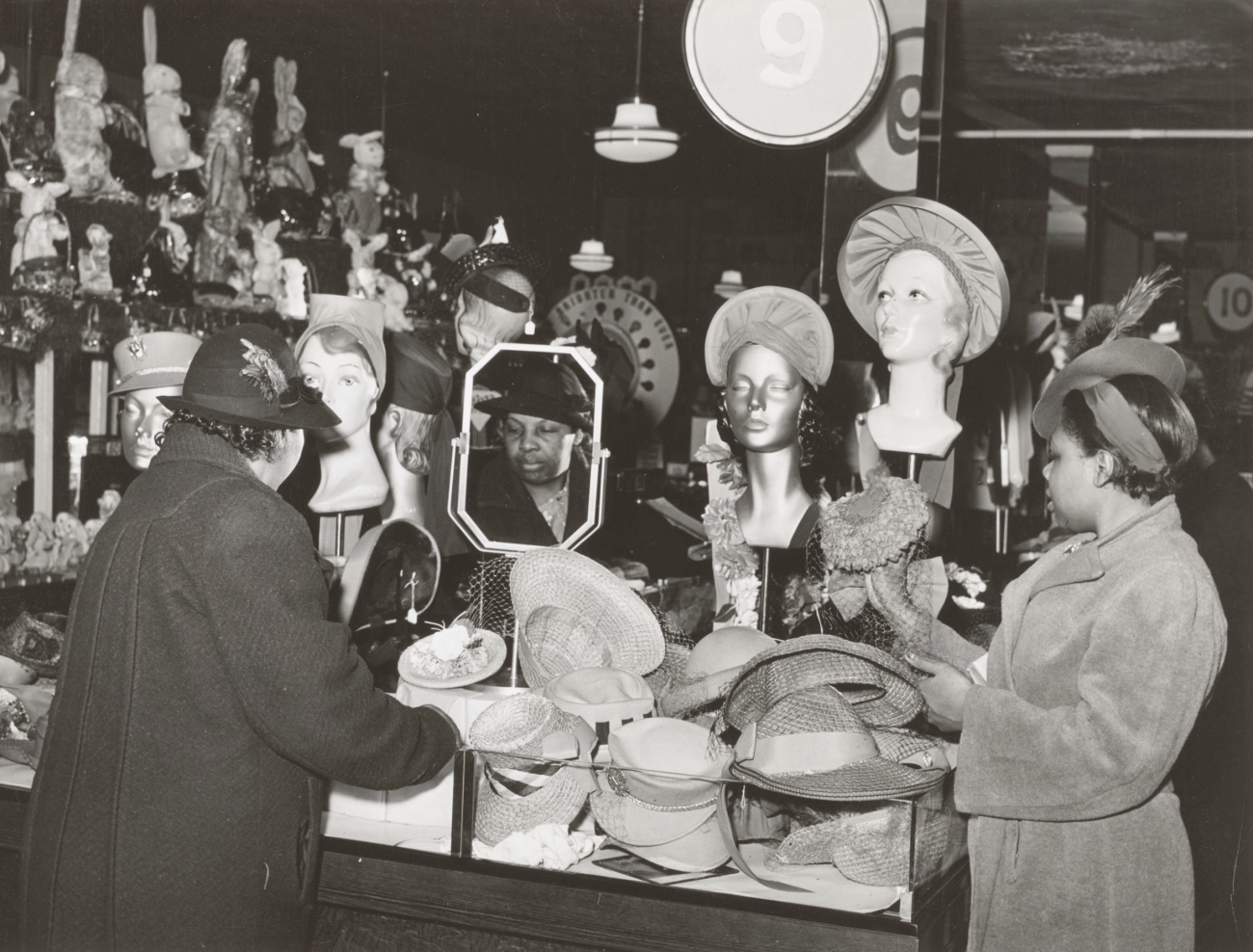 women buying hats at 10 cent store 1941