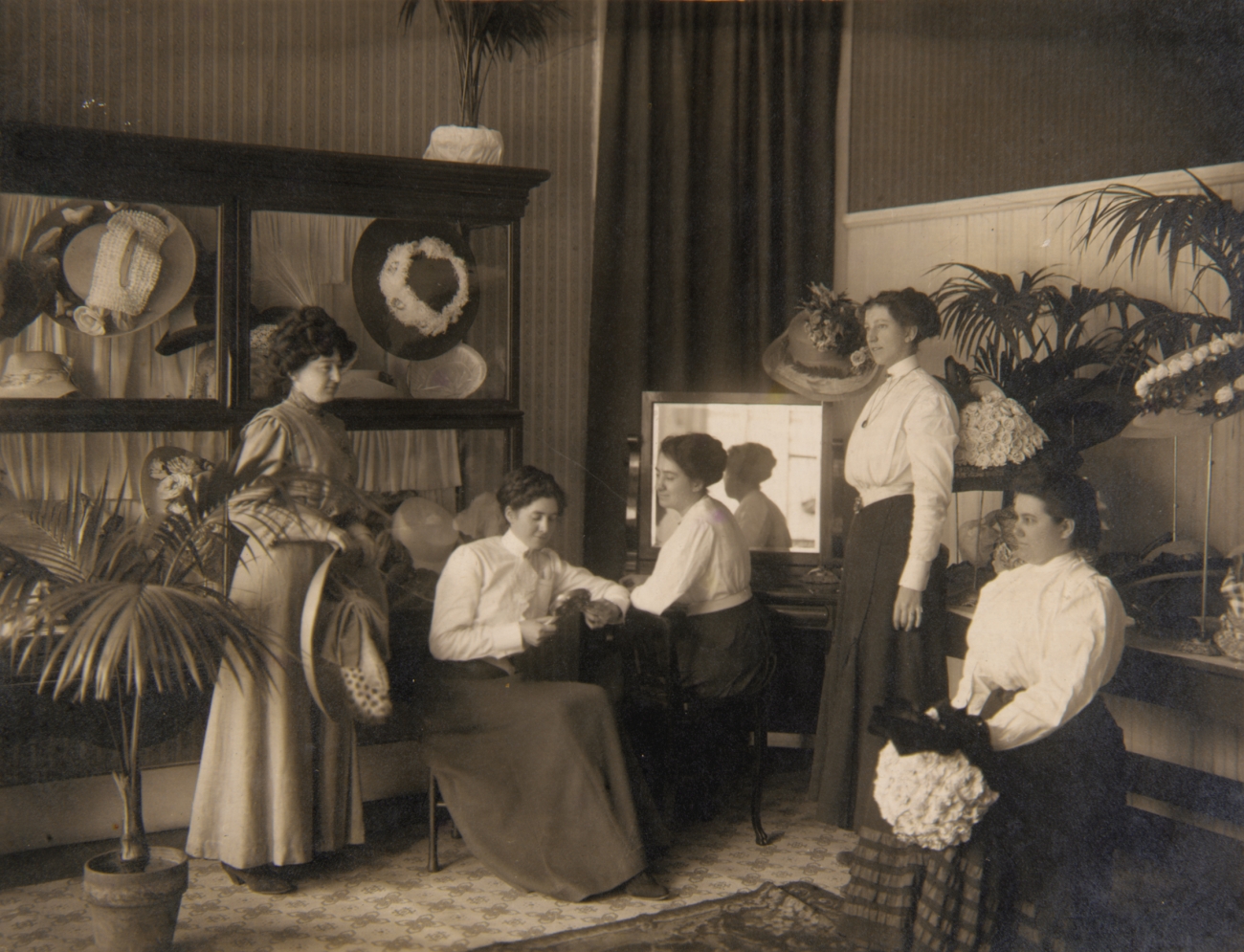 1910s women in a custom hat shop