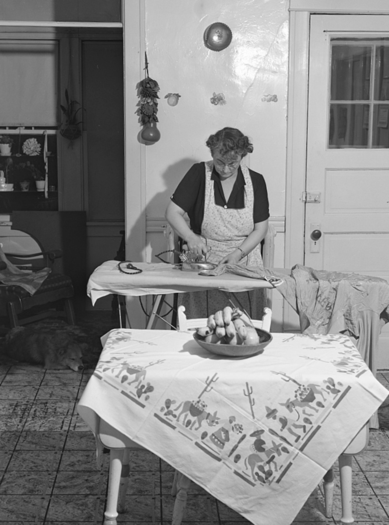 1940s housewife Ironing in Her Kitchen