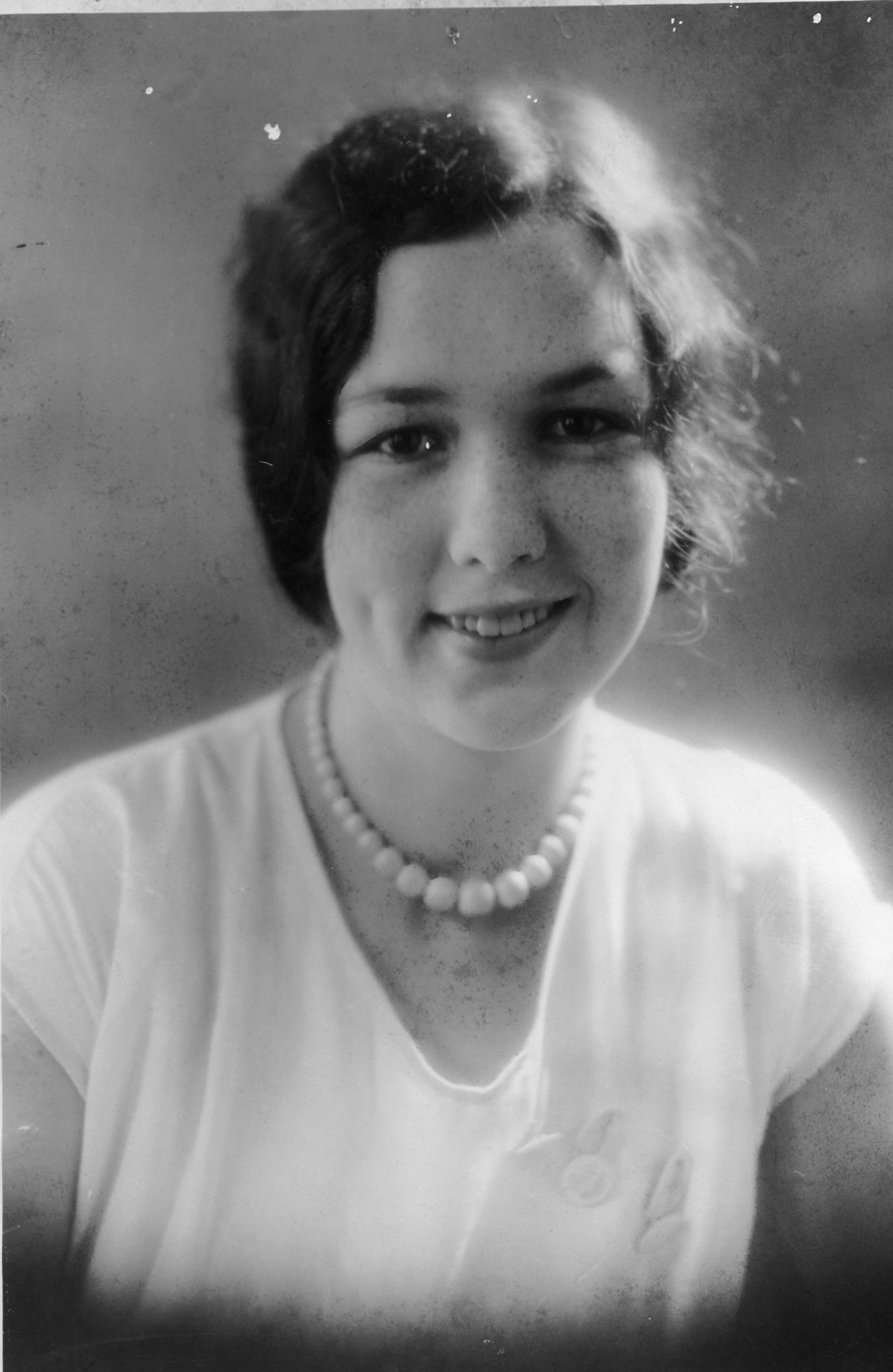 Woman Wearing Graduated Pearl Necklace