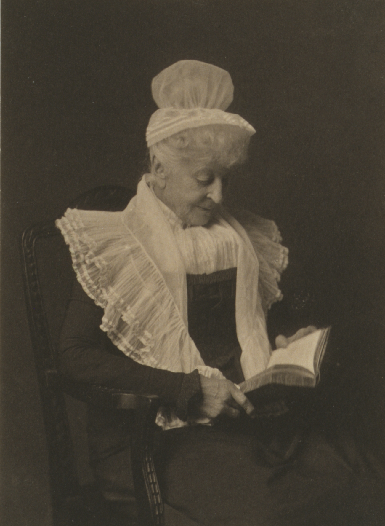 Elderly Woman in Bonnet Reading a Book 1900